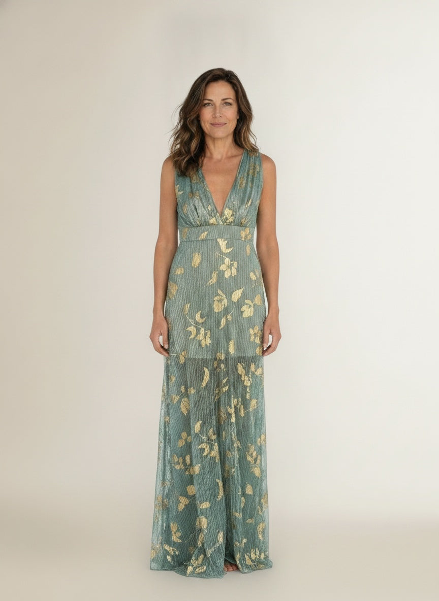 Full body view of the model wearing Mouwloze jurk met gouden sterrenprint en diepe V-hals voor dames